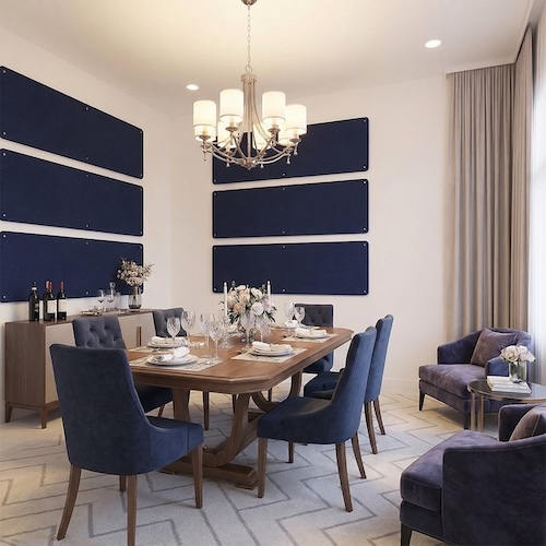 Navy blue wall-mounted acoustic panels arranged horizontally in a modern dining room with upholstered chairs, a wooden table, and chandelier.
