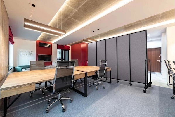 This office uses a Straightflex room divider to create privacy in a conference room.