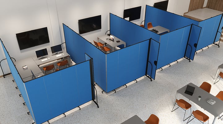 Blue room dividers surround workspaces