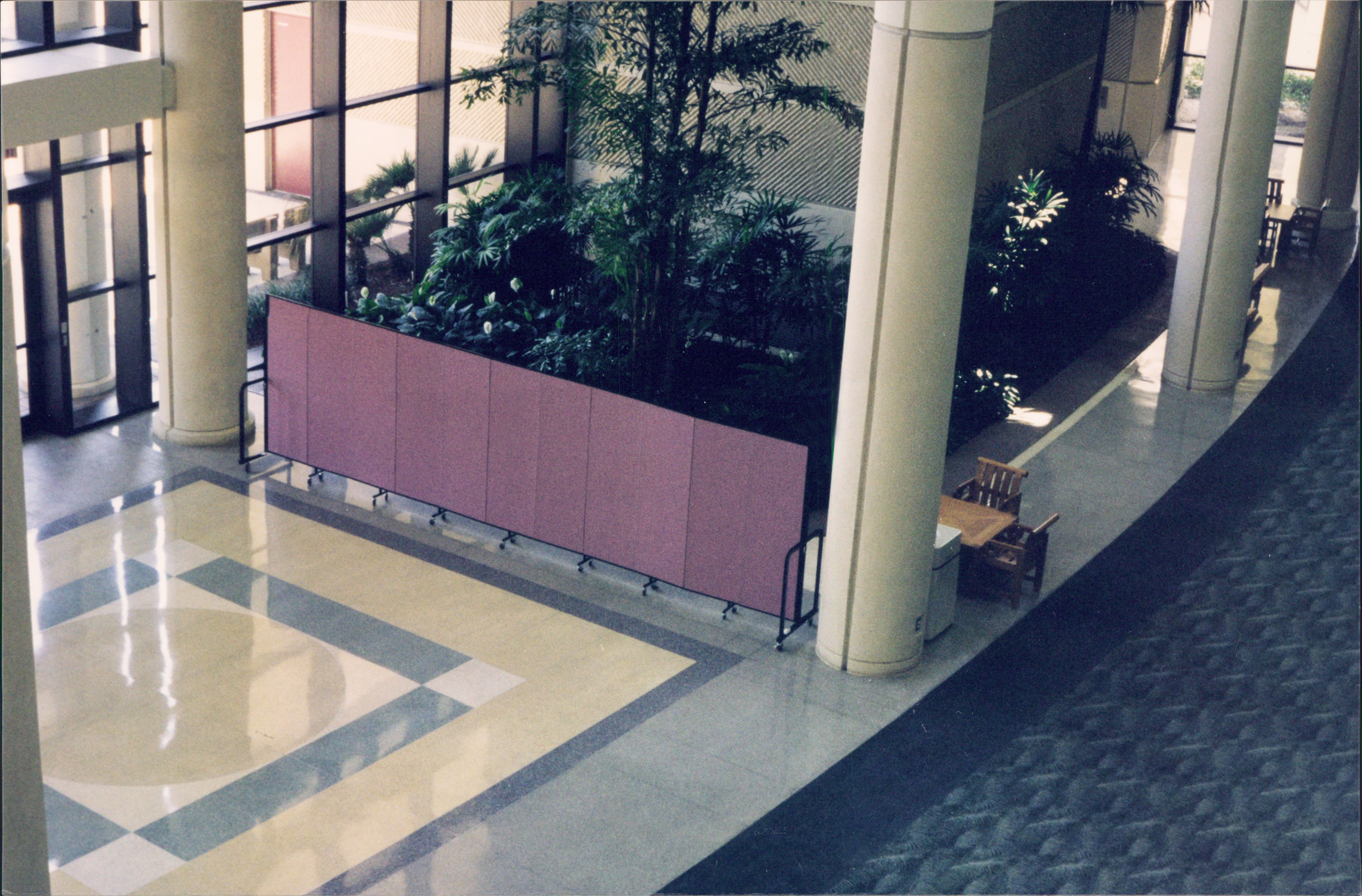 A room divider protects guests from a construction area in the hotel lobby