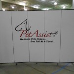 Pet Assist we make pets happy one tail at a time logo on a white 5 panel Screenflex Room Divider