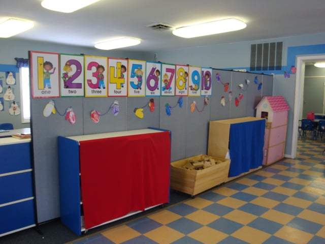Temporary room dividers dividing space in a day care facility Temporary room dividers dividing space in a day care facility