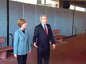 A wall of Screenflex Room Dividers creates a barrier for President and First Lady George W. Bush at the Walter Reed Medical Center