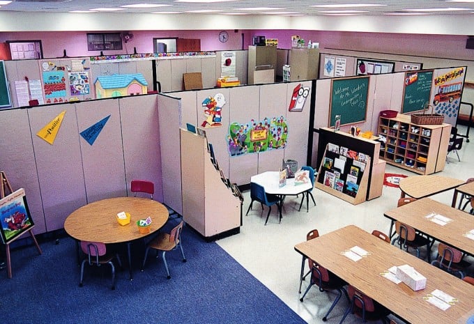 A school converts a large open space into multiple classrooms with Screenflex Room Dividers