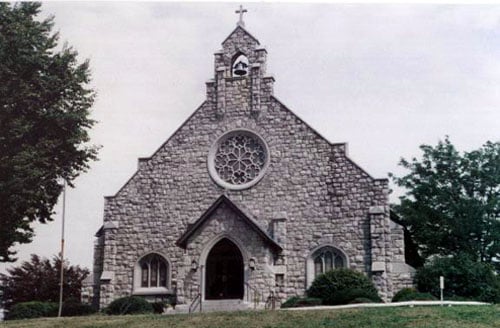 The stone front of the Holy Trinity Church building in Poughkeepsie, NY