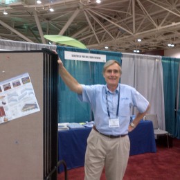 Man with Screenflex Room Dividers at a Trade Show