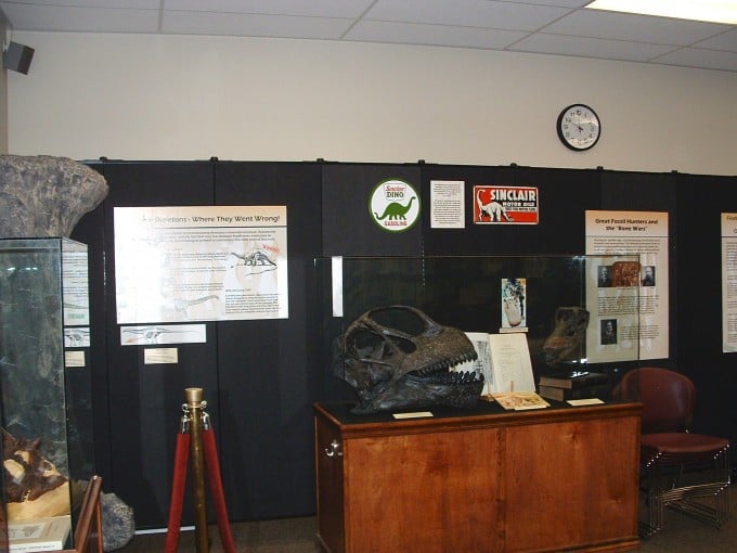 Black room dividers are a backdrop to a museum display