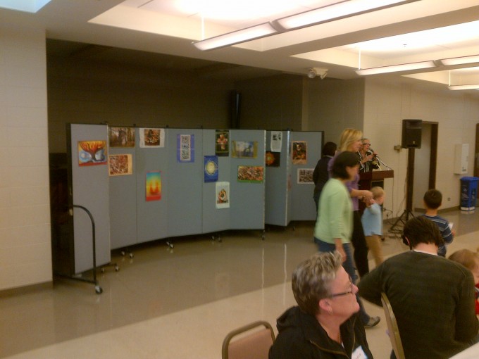 Speaker backdrop made from a room divider