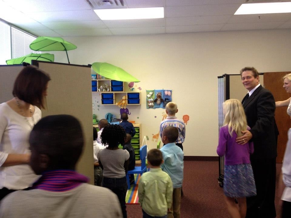 Students and staff view a newly decorated Sunday School room