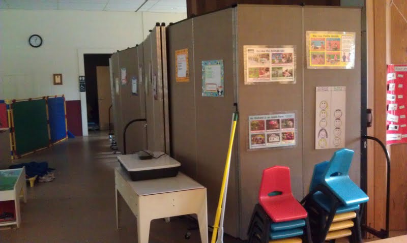 Room dividers create a storage closet in a preschool classroom