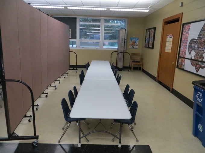 Classroom partitions separate a cafeteria into multiple classrooms