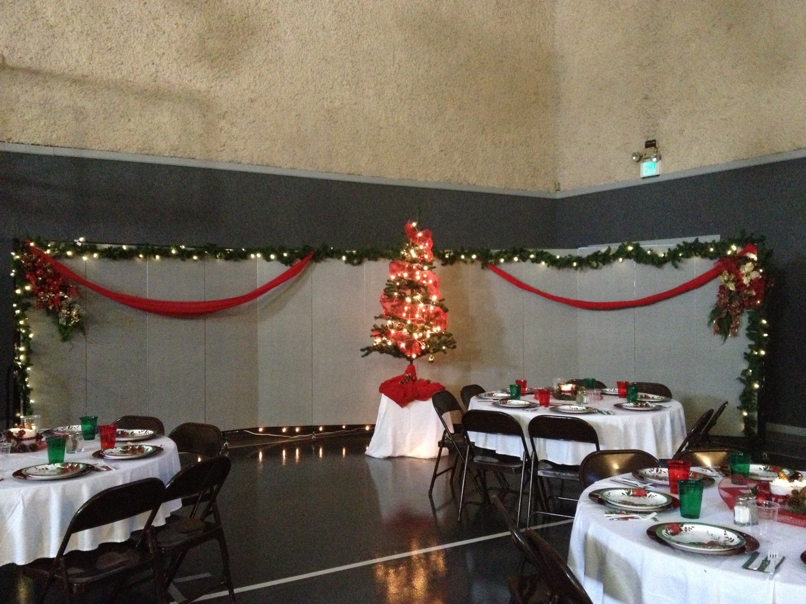 Decorated Room Dividers create a great privacy wall for Christmas banquet.