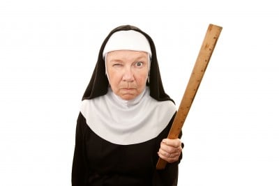 Stern Looking Nun with Ruler