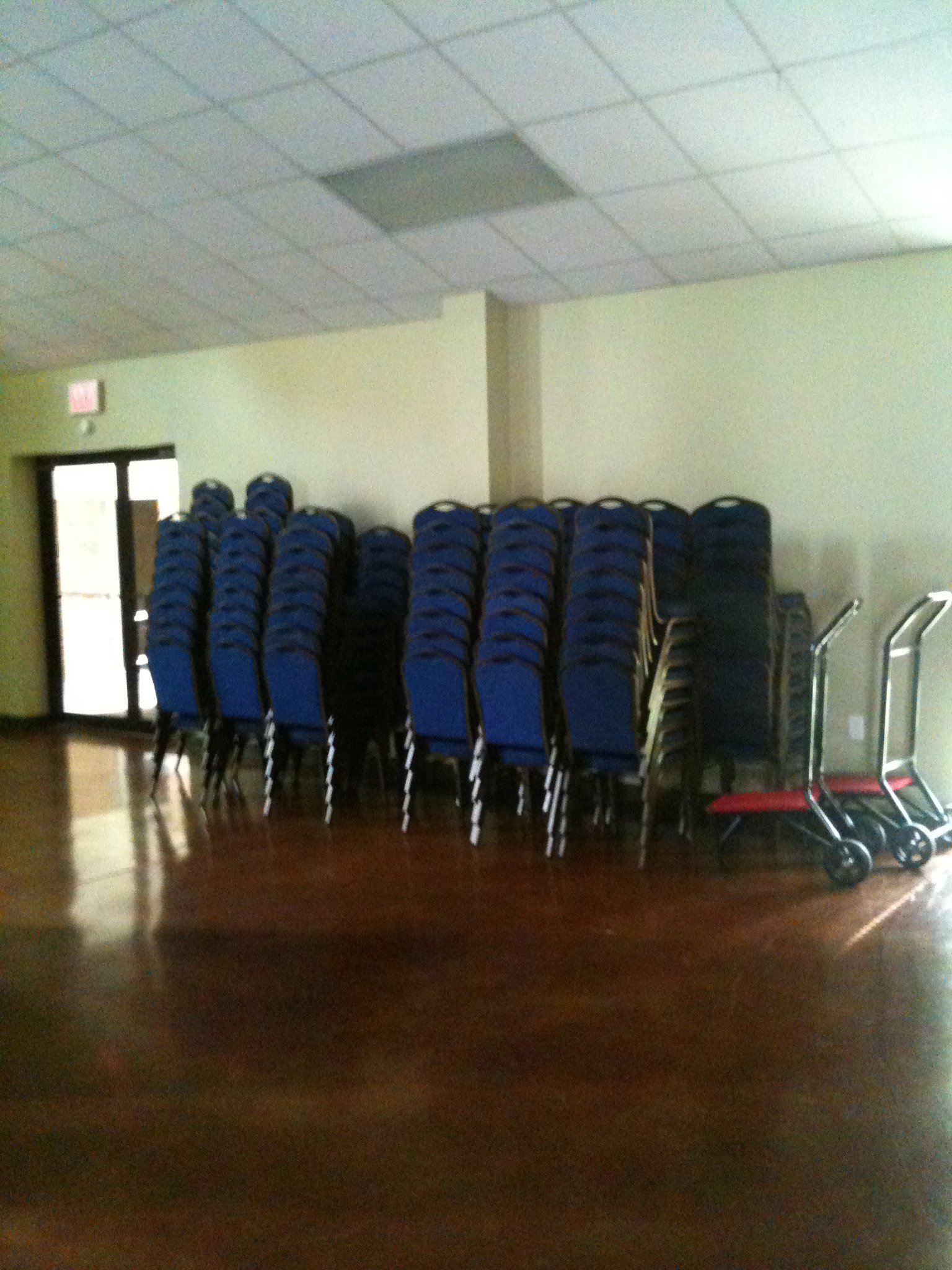 stacked chairs along a wall.