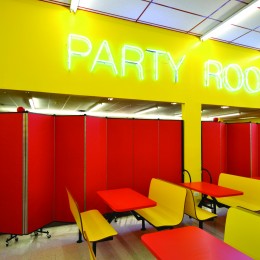 Party room space separated from game room with Screenflex Room Dividers at an indoor amusement park.
