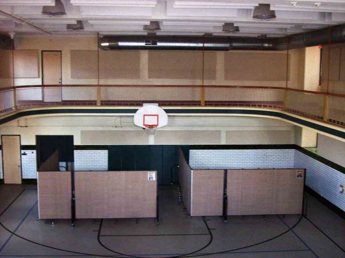 Room dividers creating classrooms in a school gym