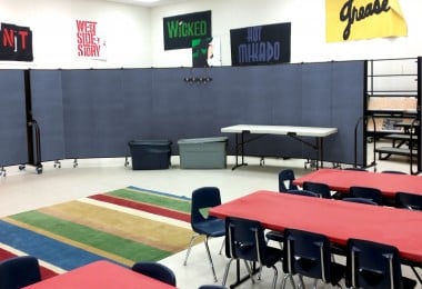 Mobile classroom with portable dividers hiding choir risers
