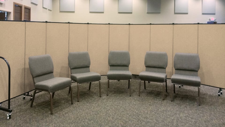 A room divider creates a small group meeting space in the sanctuary