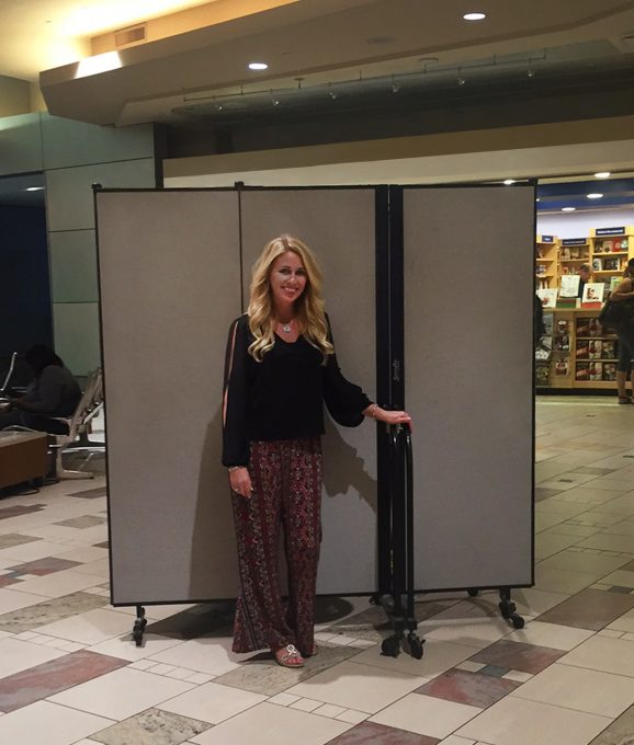 Movable safety screen Maintenance safety screen rolls on wheels that lock into place