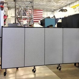 A 5 foot portable wall blocks access to an airport hangar