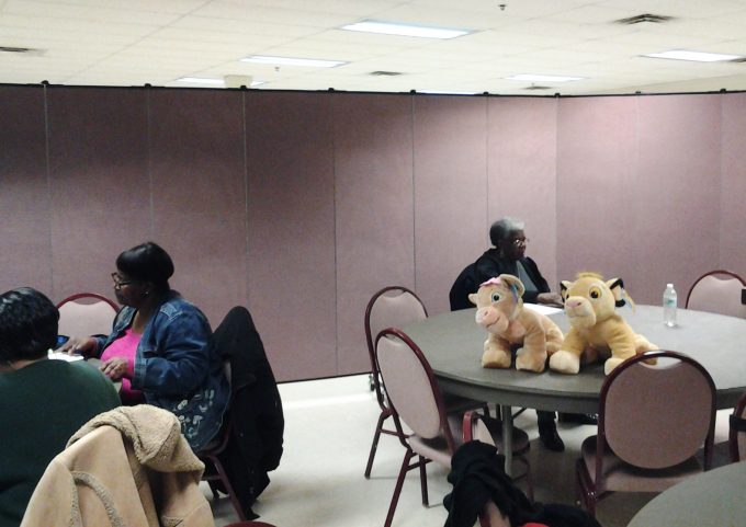 Church folding room dividers separate a fellowship hall into multiple rooms