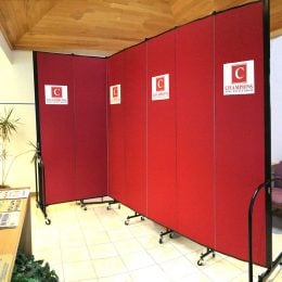 Red Room Divider with a logo pressed onto the fabric panels