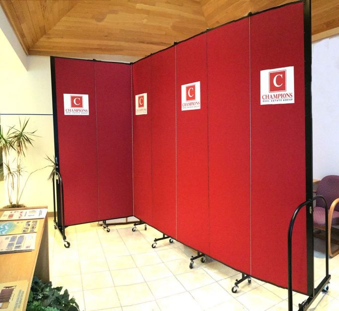 Red Room Divider with a logo pressed onto the fabric panels
