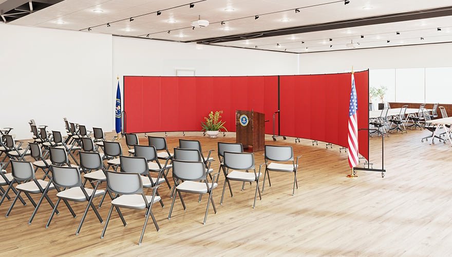 Red room divider as a speaker backdrop