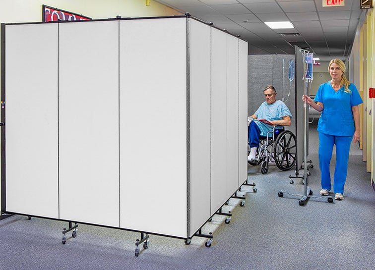 Two hospital privacy medical screens provide a private area for patients