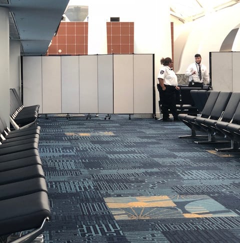 Port authority personnel supervise check-in