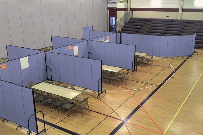 Movable partition walls create classrooms in a school gym