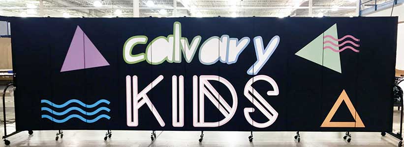 Calvary Kids logo printed on a black portable wall