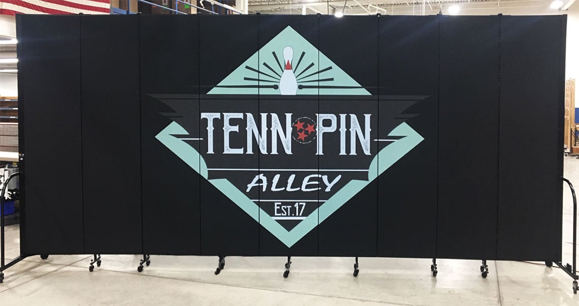 A bowling alley logo printed on a black rolling wall