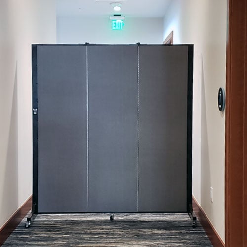 3-panel blue divider restricts access in a hallway