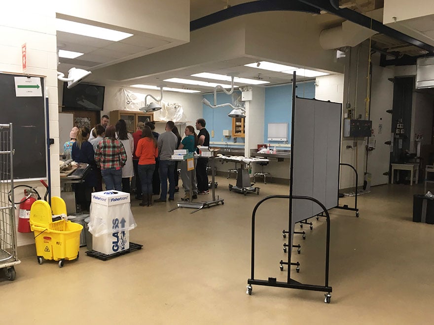 A portable wall divides a classroom lab into smaller stations