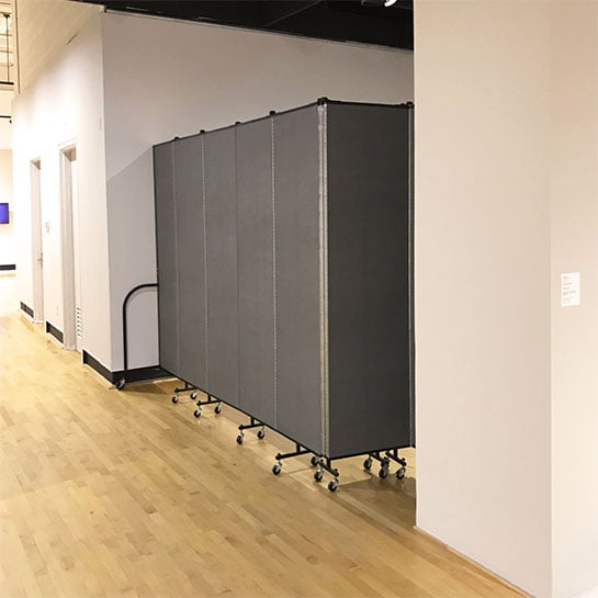 Portable walls shield access to a newly created art exhibit