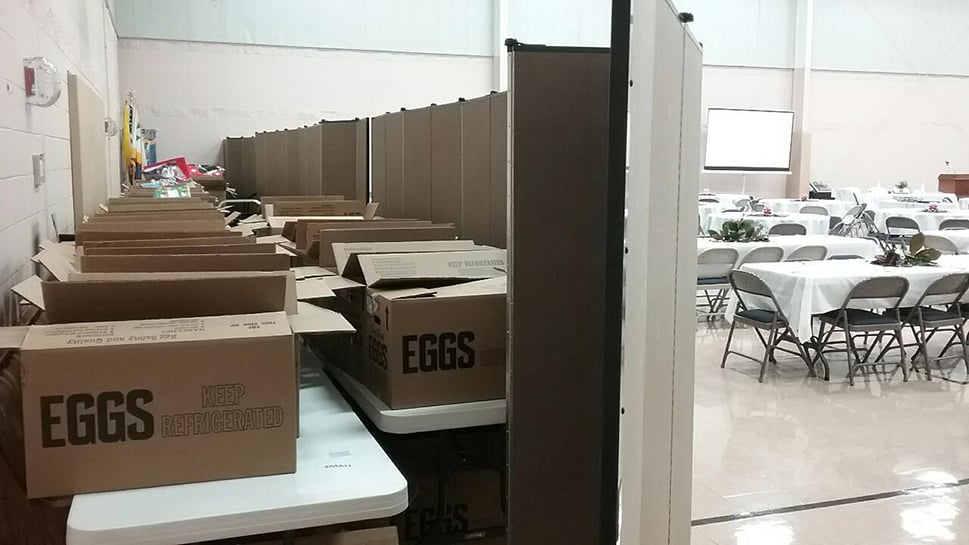 Room divider provides food storage space in a church fellowship hall