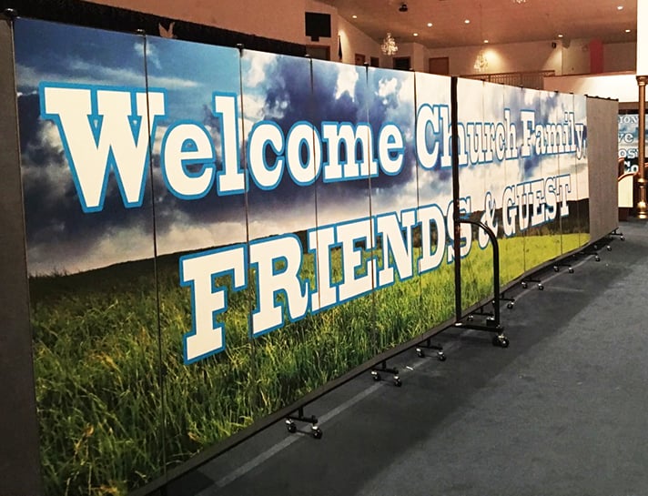 Welcome banner on a church room divider