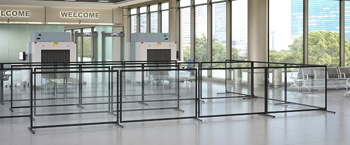 Plexiglass barricade around airport security