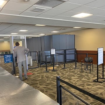 Airport security with stanchions and other crowd control devices