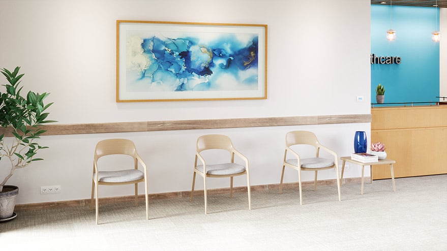 doctors office waiting room with three tan chairs