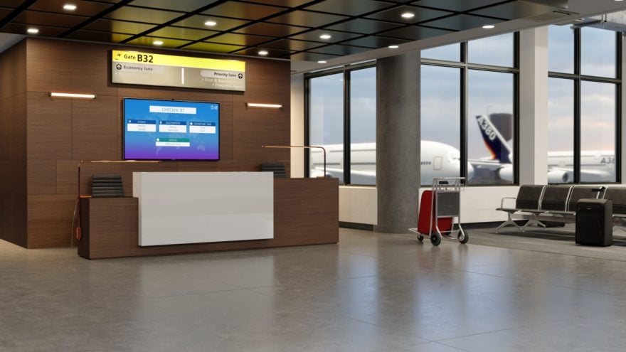 Empty gate at airport with suitcases in them