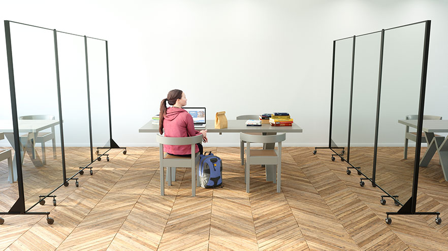 cafeteria barriers surrounding various tables