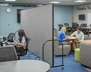 social distancing dividers separating a classroom