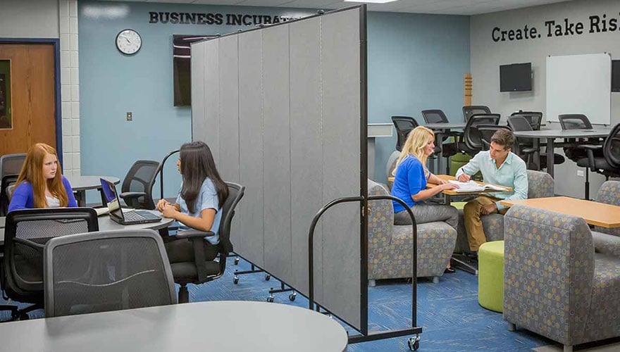 gray divider splitting a classroom in two