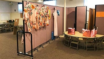 church wedding shawls hanging on a room divider