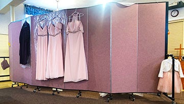 church wedding dresses hanging on a divider