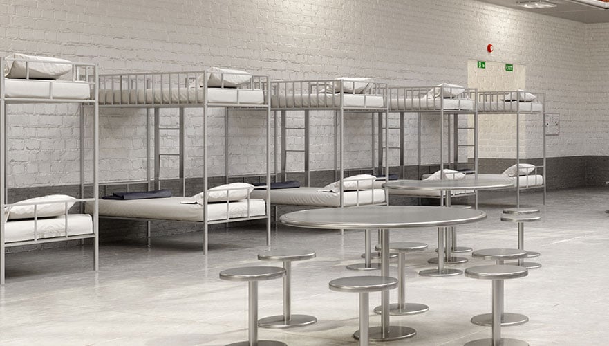correctional facility beds lining the wall