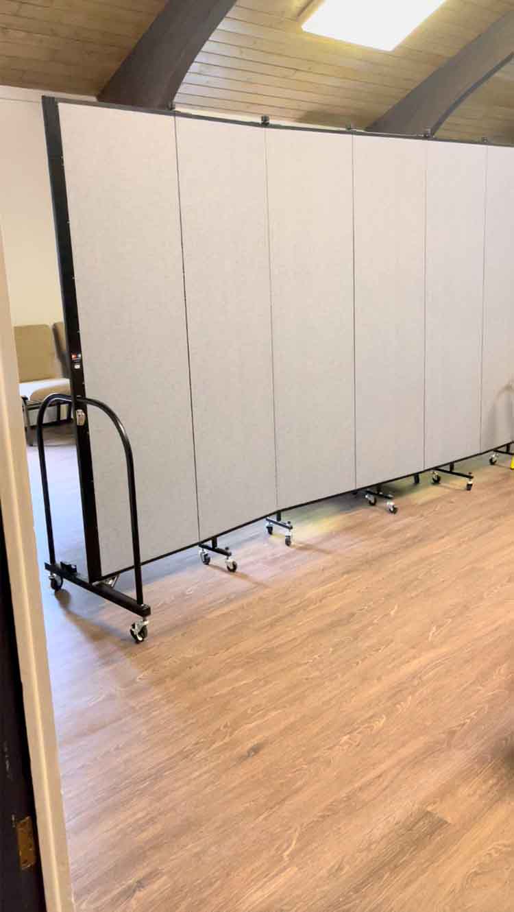 Room divider bordering kids' ministry space