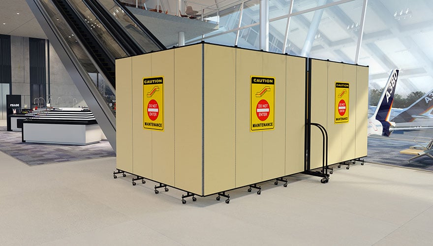 airport escalator closed for maintenance with portable barrier